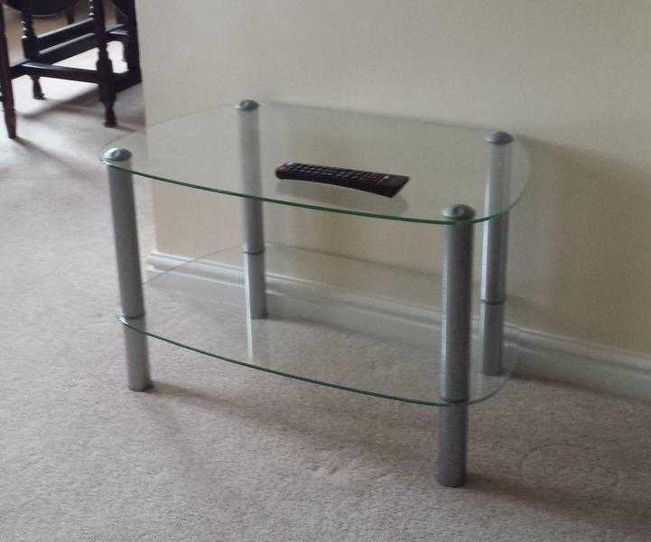 Glass TV Stand with one shelf.