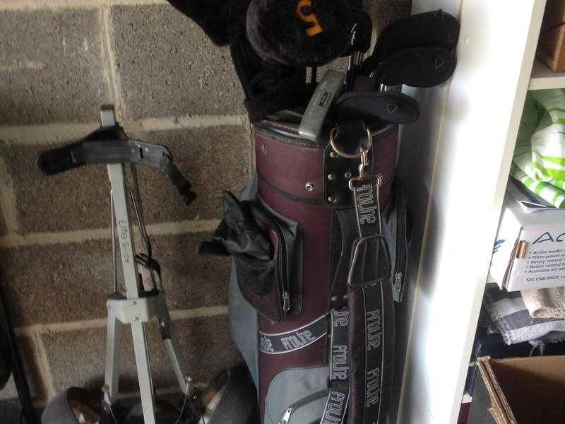 Golf clubs, bag and trolley
