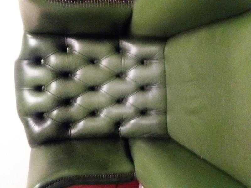 Green leather chesterfield sofa and high back chair
