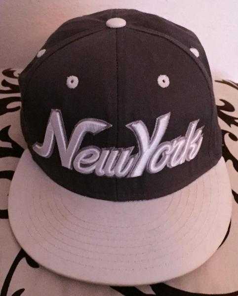 Grey and white New York snap back