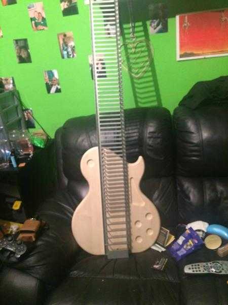 Guitar shaped CD rack