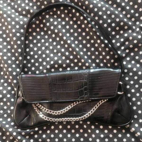 Handbag with metal chain detail