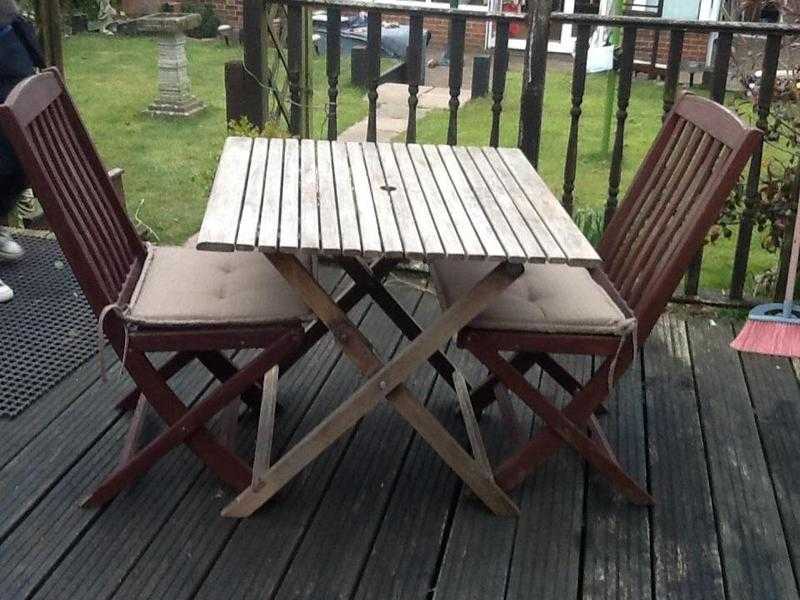 Hardwood table folding and two folding chairs with new cushions