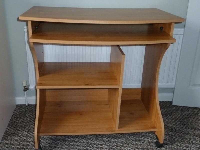 Home computer Desk with sliding shelf, on castors.