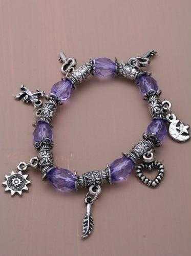 JTY013 -  Purple stretch translucent bead and silver plated charm bracelet.