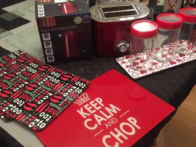 kettle , toaster , chopping boards and tea coffee  sugar containers on a tray