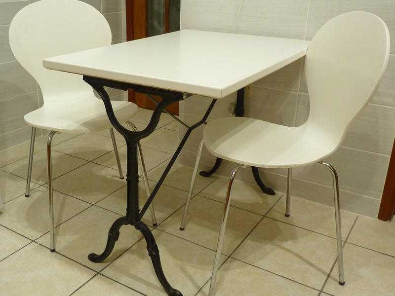 Kitchen table and two nearly chairs.