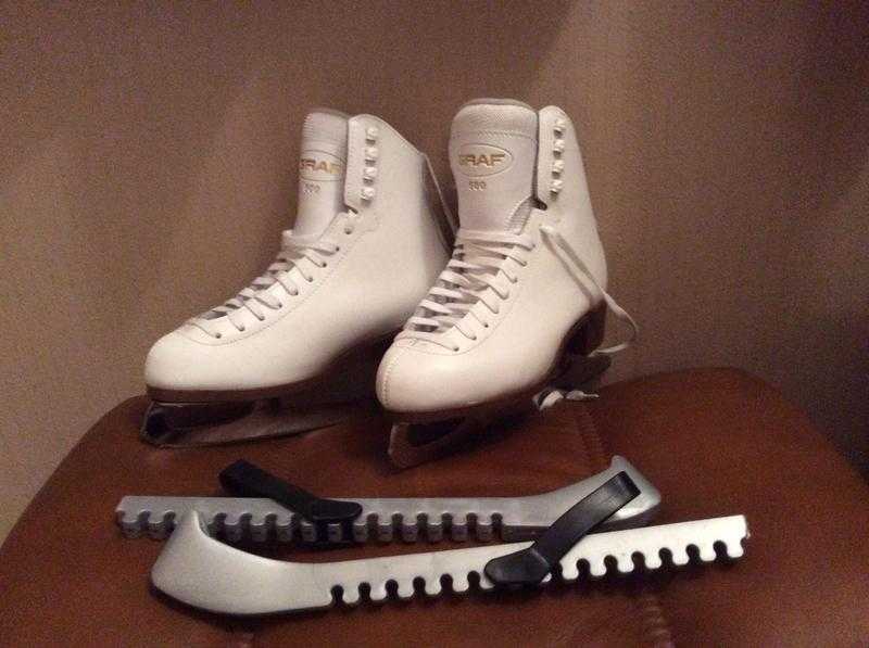 Ladies ice skates and blade guards