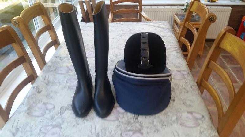 Ladies riding boots and helmet