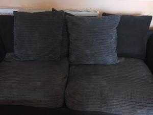 large black leather and charcoal grey suede corner suite RRP1800