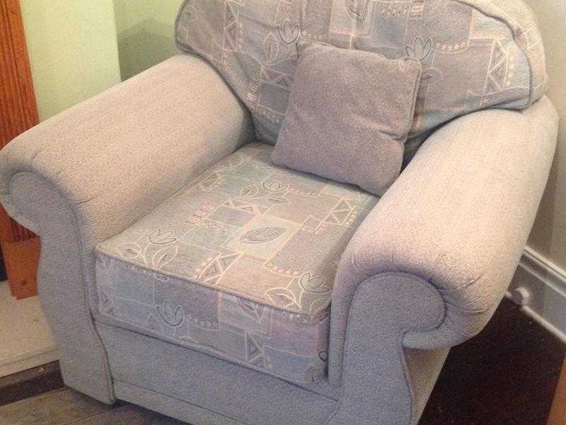 Large comfy armchairs, pale green with patterned cushions