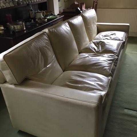 Large cream leather sofa in need of tlc