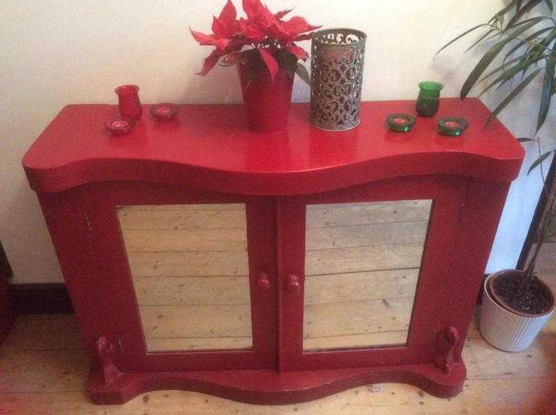 Large, crimson red wooden storage cabinet