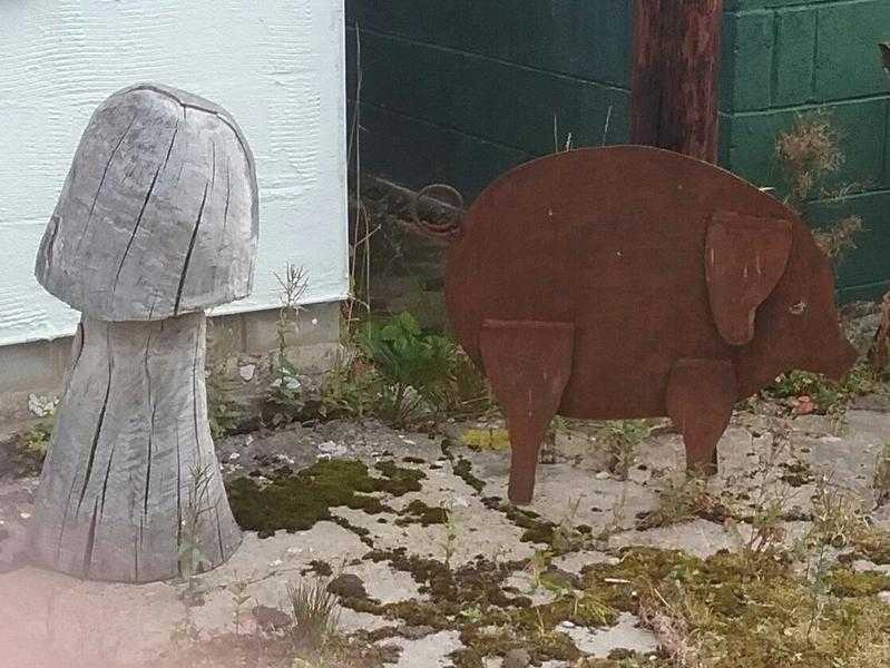 Large metal pig sculpture