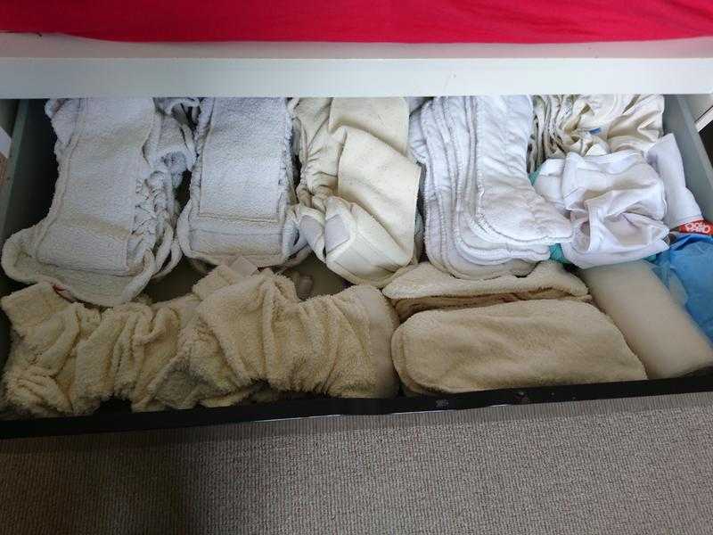 Large set of cloth nappies, liners, wraps and wash bag