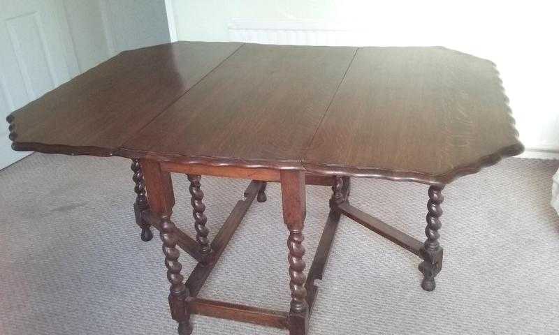 Large solid oak drop leaf table and fours chairs