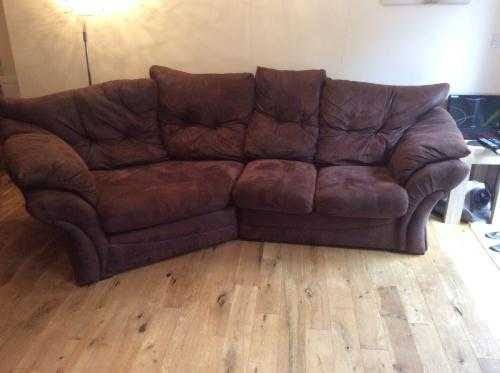 Large suede three-seater corner sofa