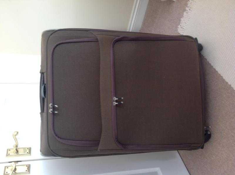 Large suitcase used once on single journey