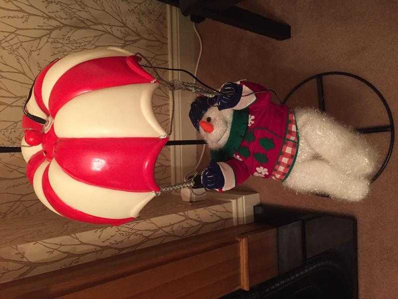 Large swinging snowman on stand