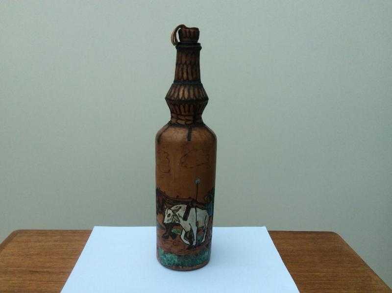 Leather covered bottle.