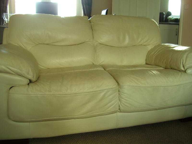 leather three seater and two seater plus footstool  cream