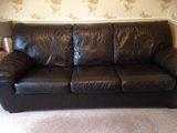 Leather three seater sofa bed and two seater sofa, dark brown.