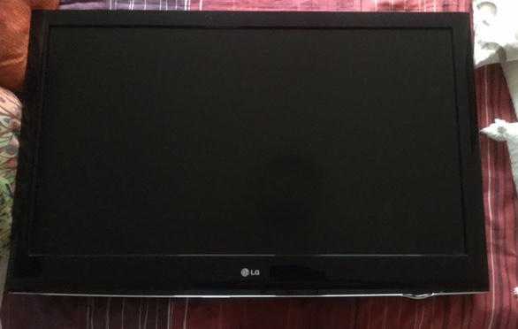 LG 42quot Flat Screen TV amp Black glass stand, plus a DVD player