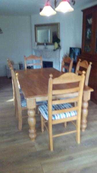 Light oak dining table with six chairs