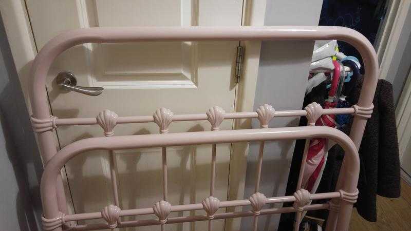 light pink metal bed