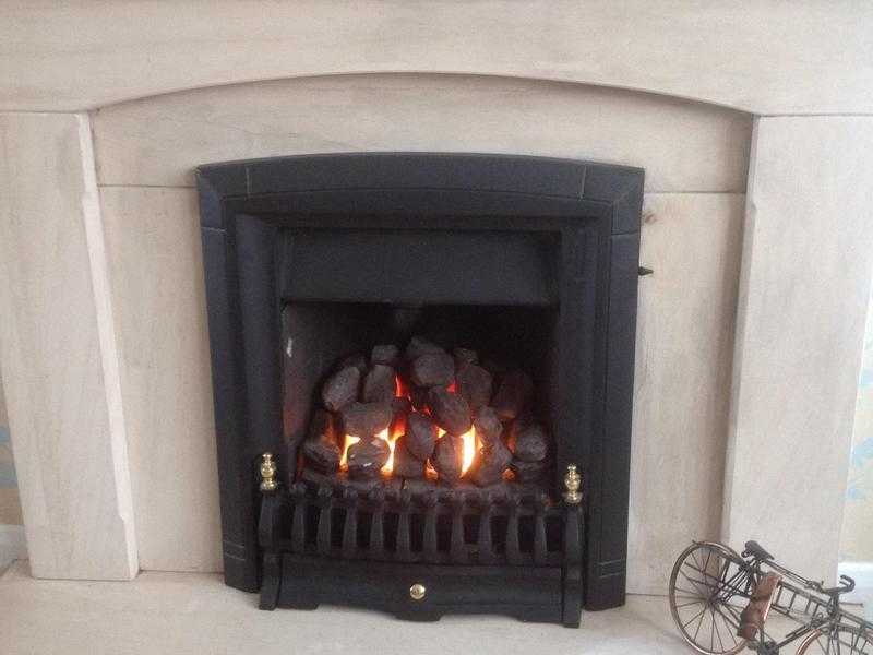 Limestone fireplace and gas fire