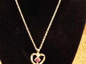 links beacelet with heart charm,unwanted gift, worn once, no box, good condition.