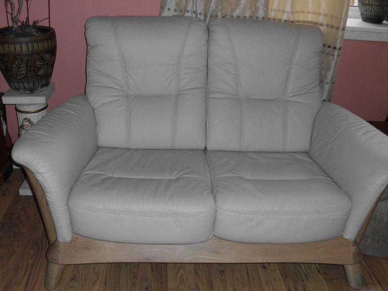 Lovely beige 2 seater soft leather sofa in good condition.