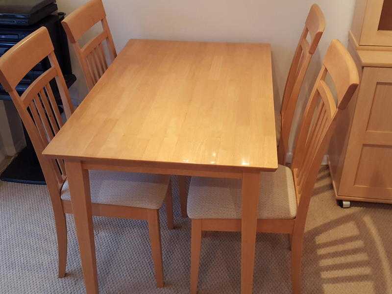 Lovely light solid wood modern dining table with 4 matching chairs