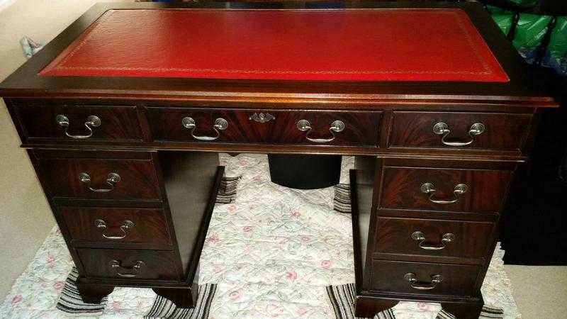 mahogany desk with red leather top