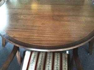 Mahogany extendable dining table and six chairs