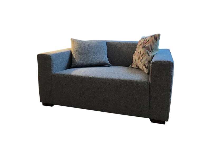 Modern grey armchair with matching pillow