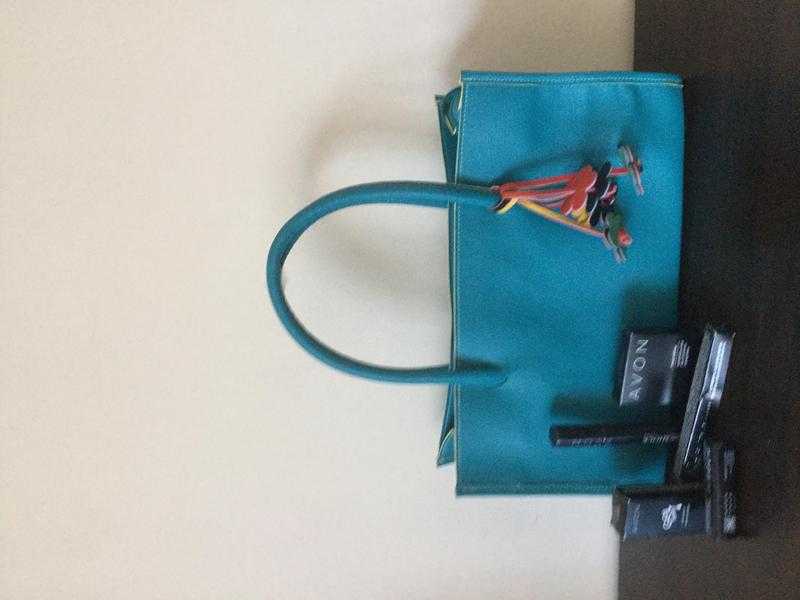 Nathalie Andersen bag with Avon make up