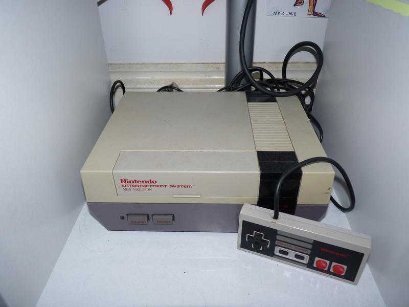 NES With 1 game, 2 controllers and Zapper gun.