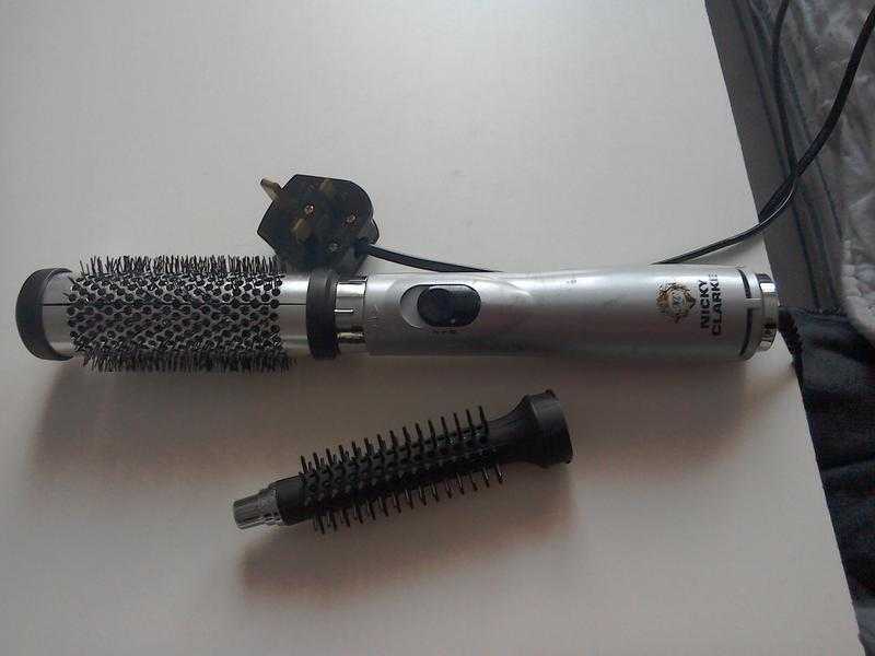 Nicky Clarke heated hair brush styler with curling attachment.