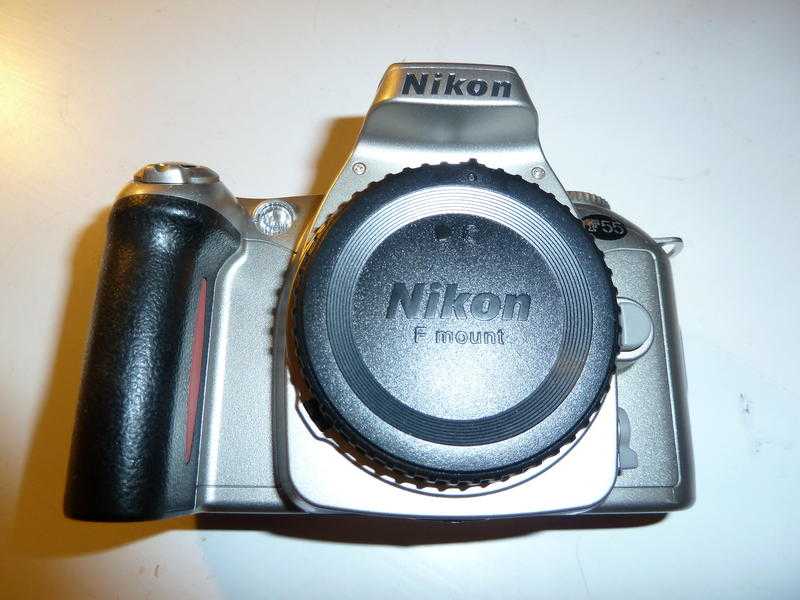 Nikon F55 Camera Body, cap and instruction booklet.