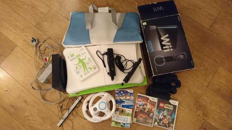 Nintendo wii console with wii fit board and games