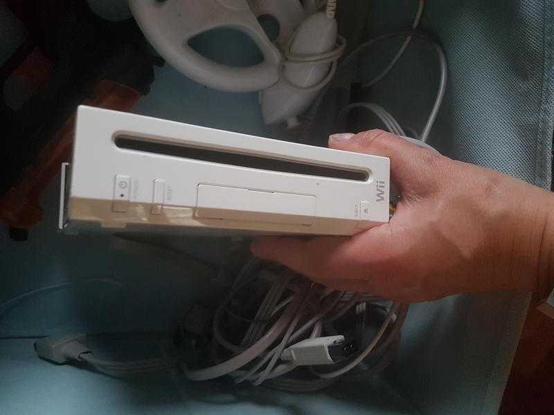 Nintendo Wii.plus board, steering wheel and games