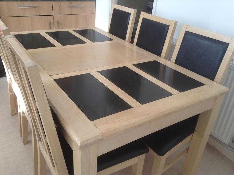 Oak and granite table with six leather chairs