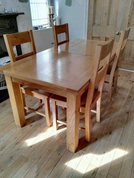 Oak dining table and four chairs