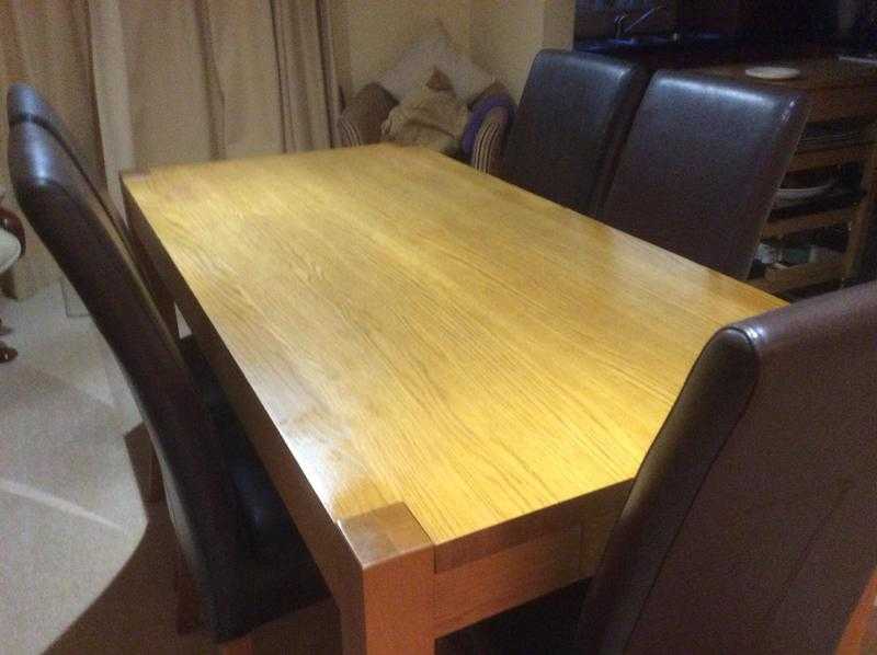 Oak dining table and six leather chairs