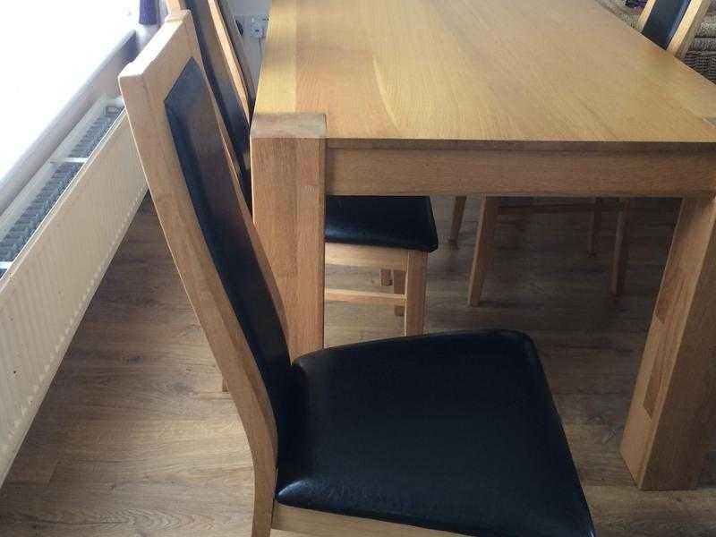 Oak dining table with veneer top and 4 chairs