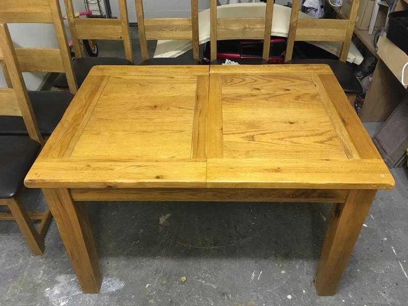 Oak extendable dining table plus six chairs