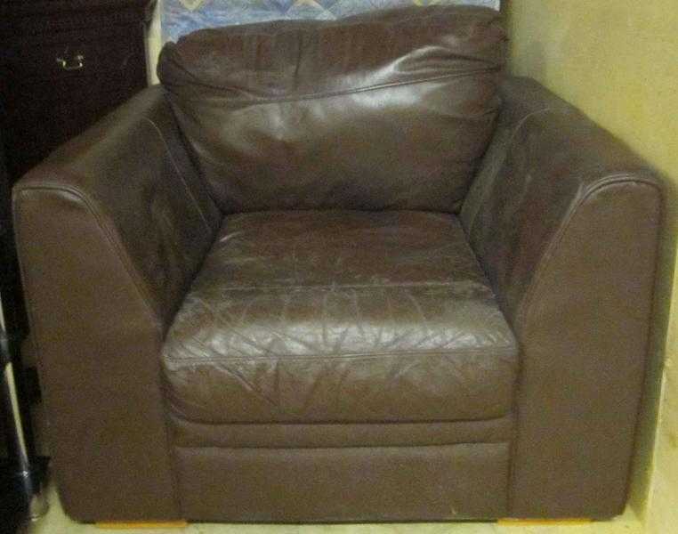 OFFERED FREE   Brown LEATHER ARMCHAIR