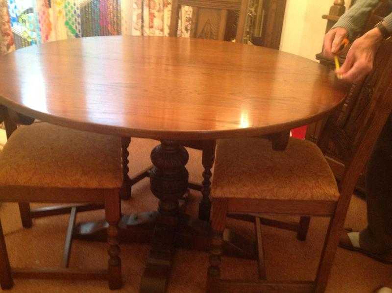 Old charm dining table and 4chairsmade by woods bros.