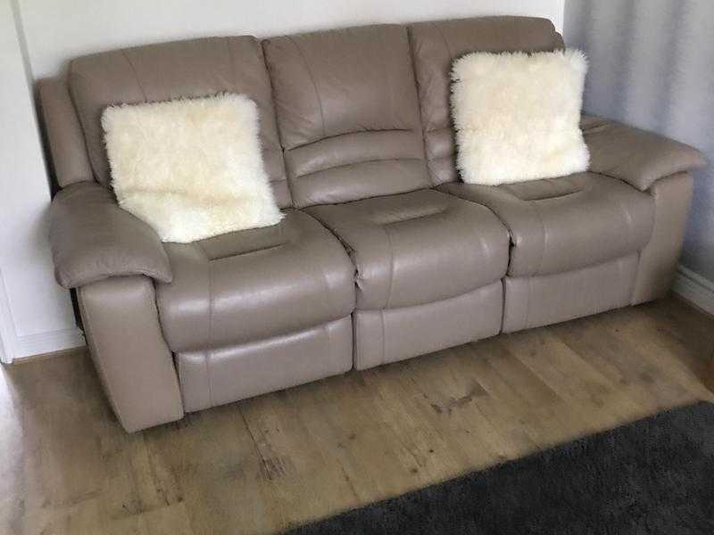 One 3 seater leather electric recliner and one 2 seater leather  manual recliner